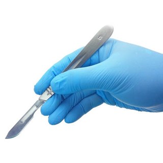 Surgeon's gloved hand holding a scalpel